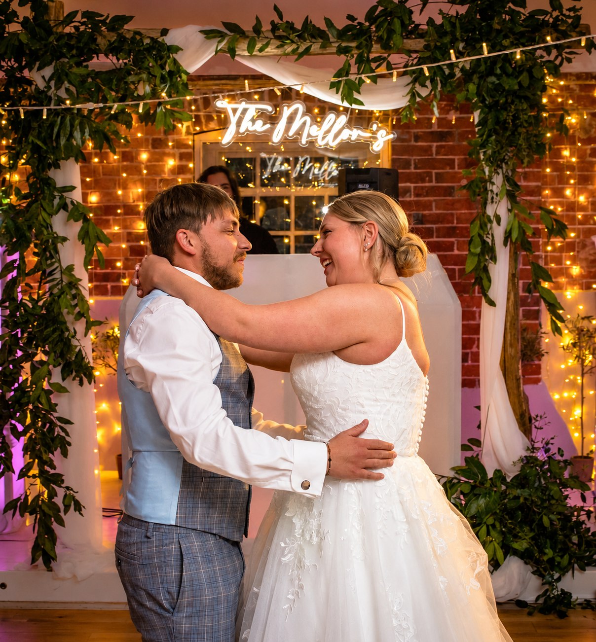 Bride and groom dancing beneath personalised wedding lighting at a Dorset disco
